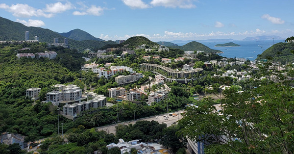 郊野公園邊陲綠化地，為何不建樓解決民生？