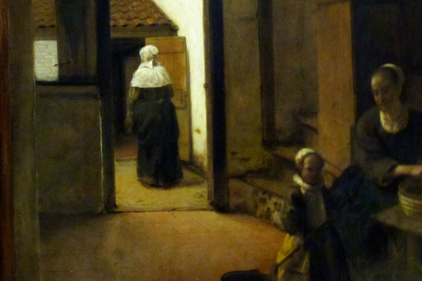 正在後房擇菜的婦人